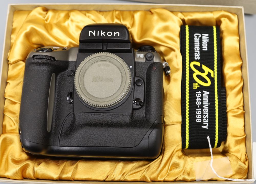 A Nikon F5 SLR camera body in original 50th Anniversary model boxed, virtually mint